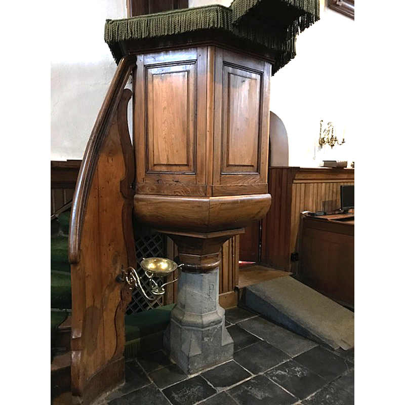 showing the Reformation metal font by the foot of the pulpit, itslef a re-used base of an earlier font