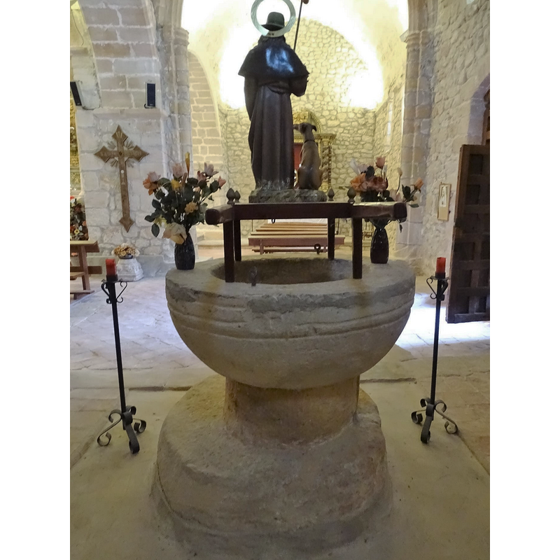 the wooden onject on top of the font is not a font cover but a procession float just rested there
