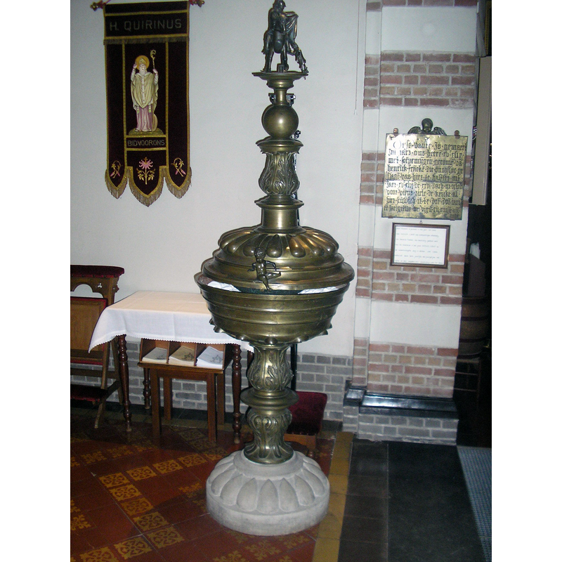 the metal plaque on the wall states the font was a donation in retribution for a murder