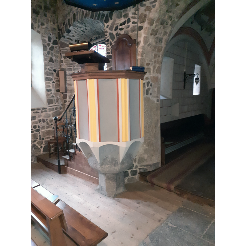 mounted on an ancient baptismal font
