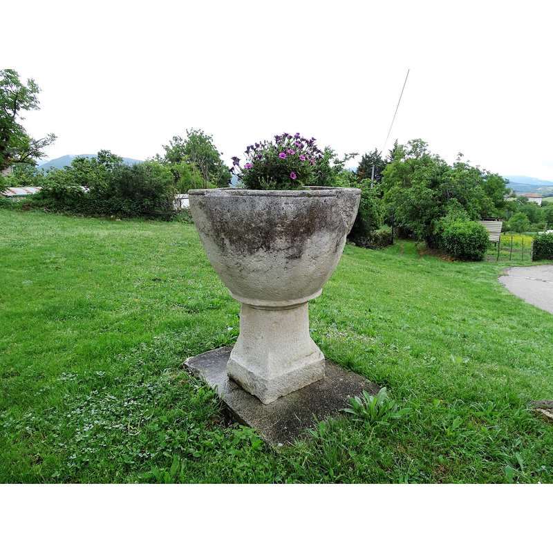 the font was located earlier inside the church, in the apse; it is now [2021] used as planter outside the church
