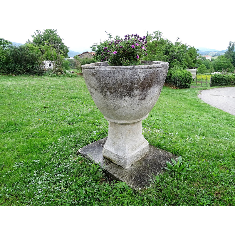 the font was located earlier inside the church, in the apse; it is now [2021] used as planter outside the church