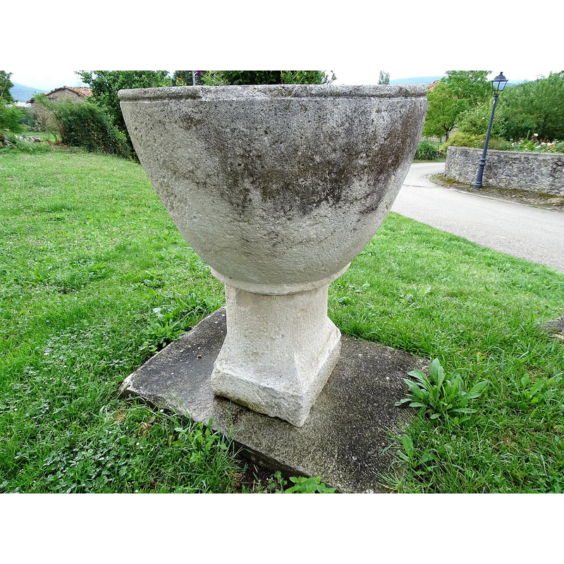 the font was located earlier inside the church, in the apse; it is now [2021] used as planter outside the church
