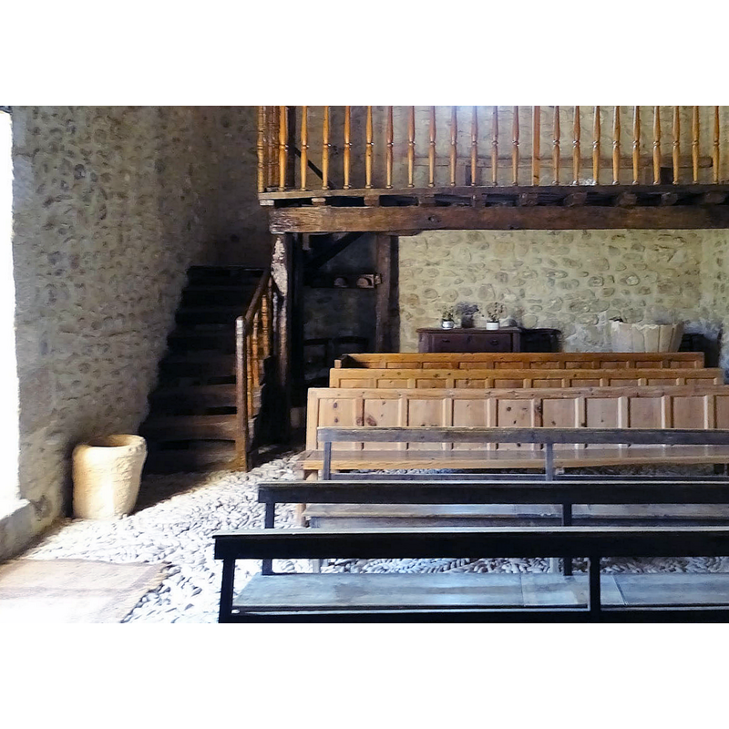 the font in the right corner, the stoup on the left, by the south entranceway