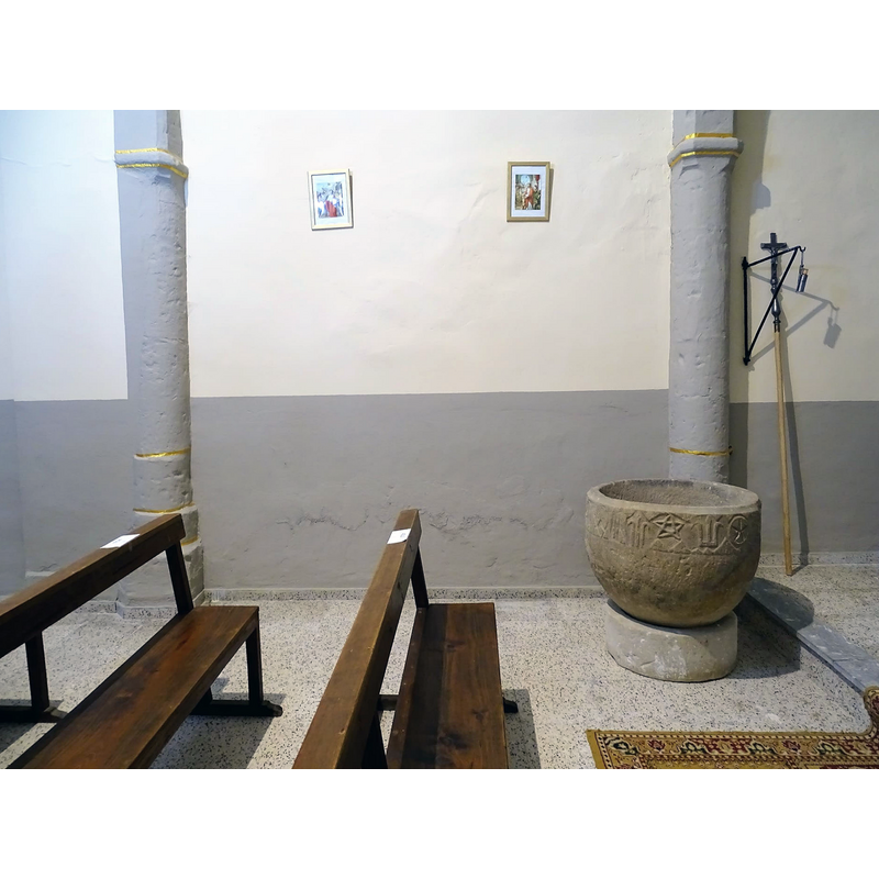 located by the north pilar of the chancel arch; the step up to the chancel seen here to the right of the font