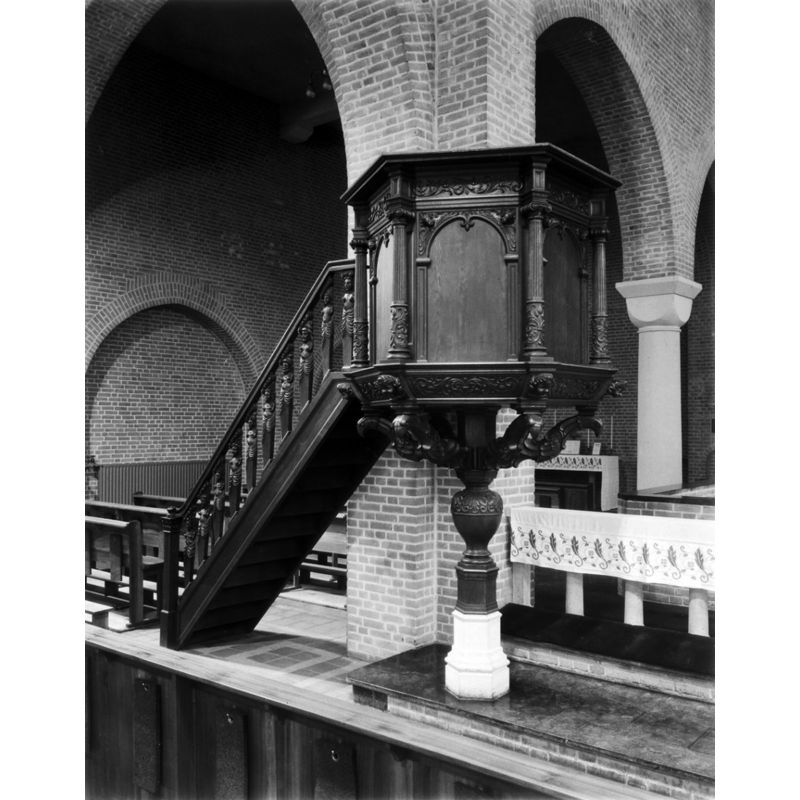 Source caption: "R.K.Kerk: preekstoel" -- the 17thC(?) pulpit seen here in 1952 survived the destruction of the old church of Huissen in May 1943; the stone base of the restored pulpit looks suspiciouslu close to a font base