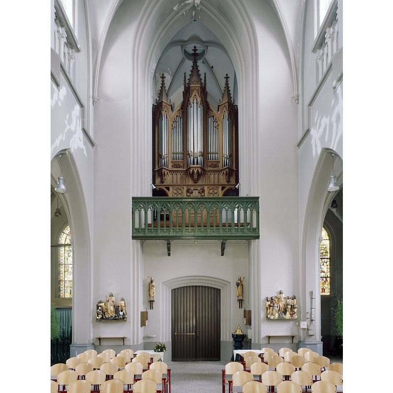 showing the baptismal font and its cover to the right [north] of the door