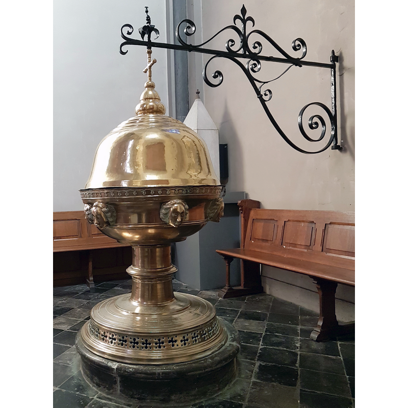 Source caption: "Baptismal font in the parish church of Saint Martin (Sint-Martinuskerk) in Maastricht, Netherlands. The font is by Johannes van Venlo (1482); the lid is from 1717."