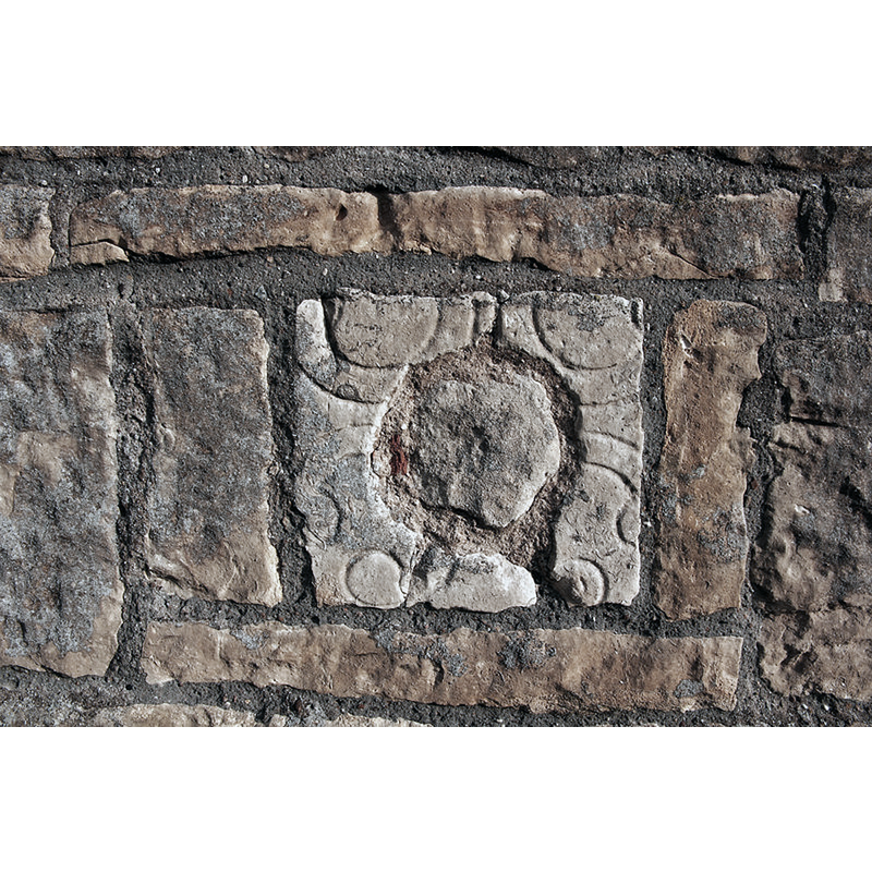 Source caption: "Anglo-Saxon window, A small, round, 11th century window with looped decoration re-set in the 13th century tower of All Saints' church"