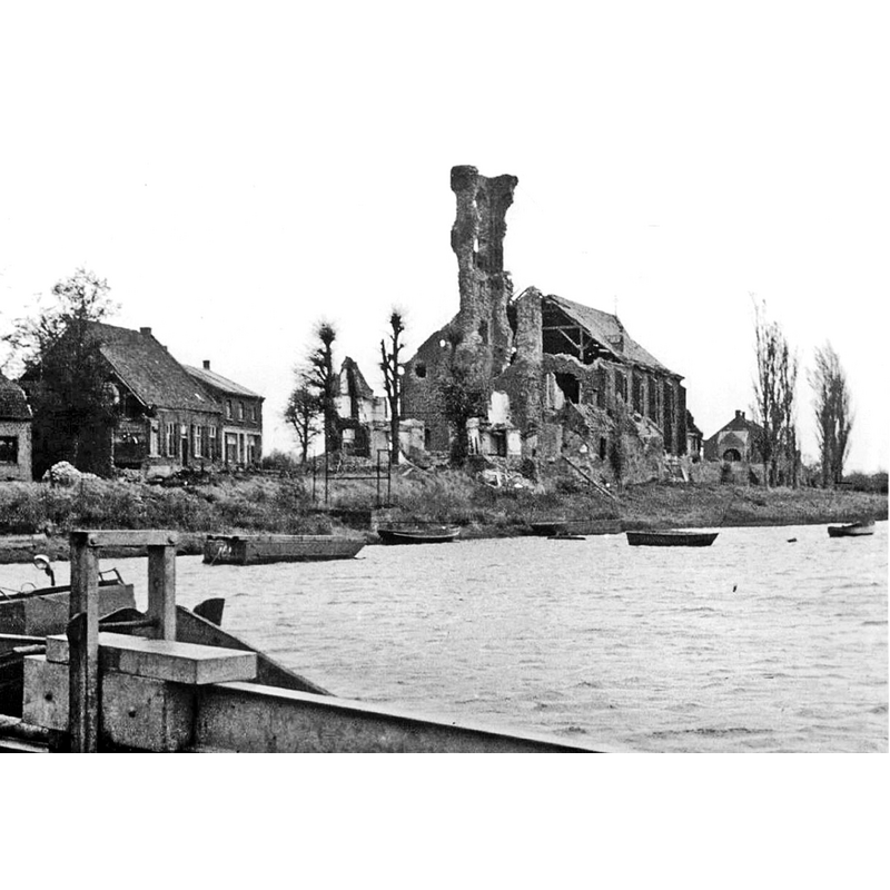 the old church, seen here across the river Maas, had been severely damaged by Allied fire bombings in 1944 and would eventually be demolished in 1956