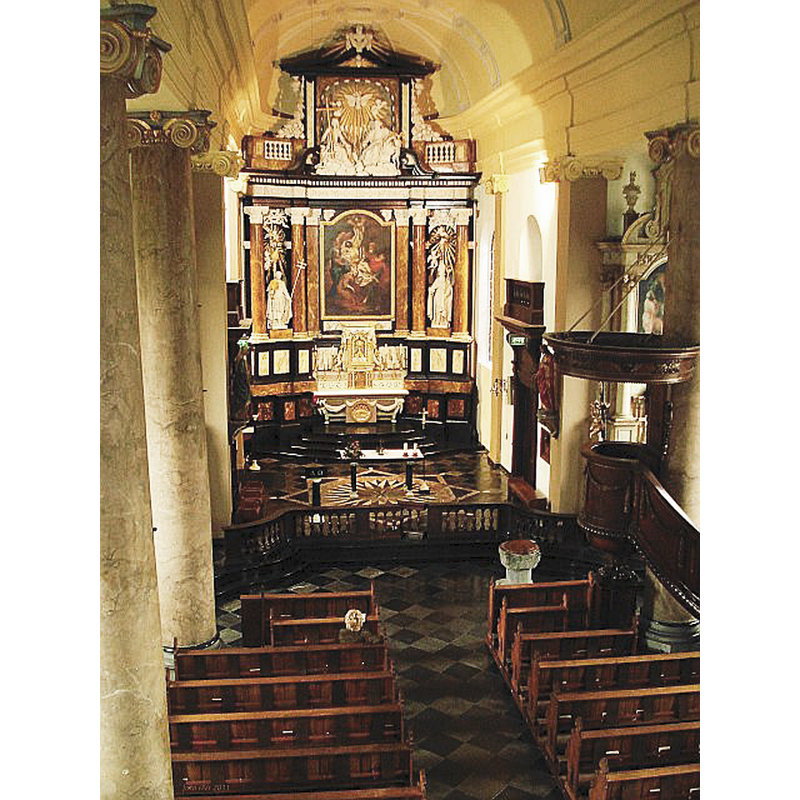 showing the medieval font in the nave, near the pulpit