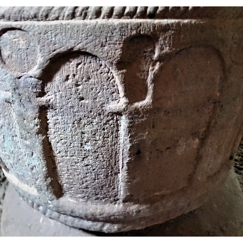 the odd shape in the spandrel here may be damage, but it could also be a combination of the original carved circle later modified with a cut below to accommodate a side lock
