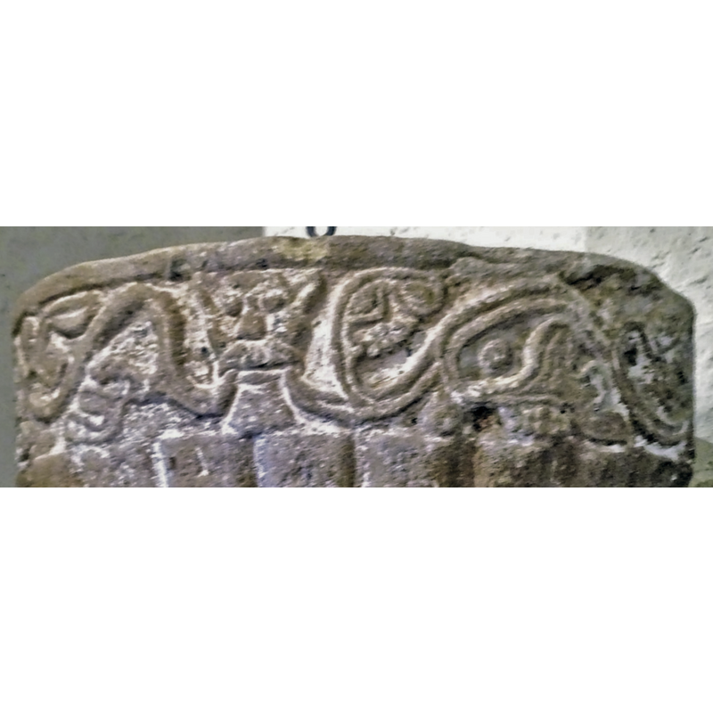 the vine extends left and right all around the basin until the section that is partly built into the back wall; it is possible that there may be a similar head in the hidden area