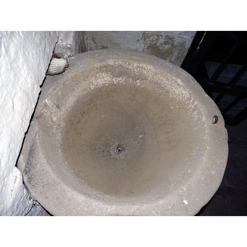 showing the central drain hole, the area of the basin partly built into the back wall and the metal staple in the upper rim