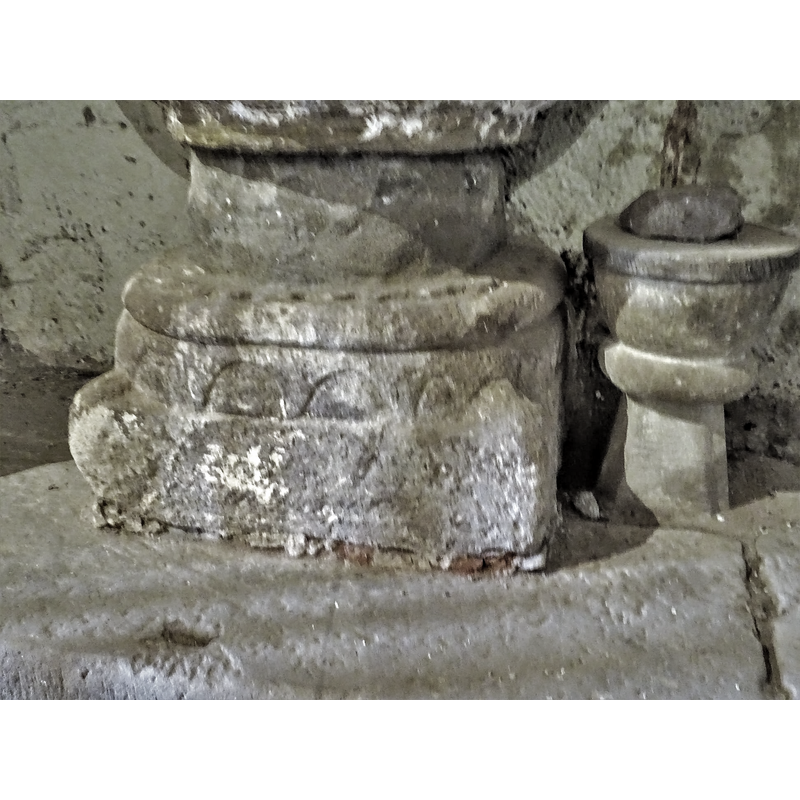 two of them, very eroded, are visble here, at the two corners; the left appears to be a ball motif; the right may ne a knob or a defaced head or mask