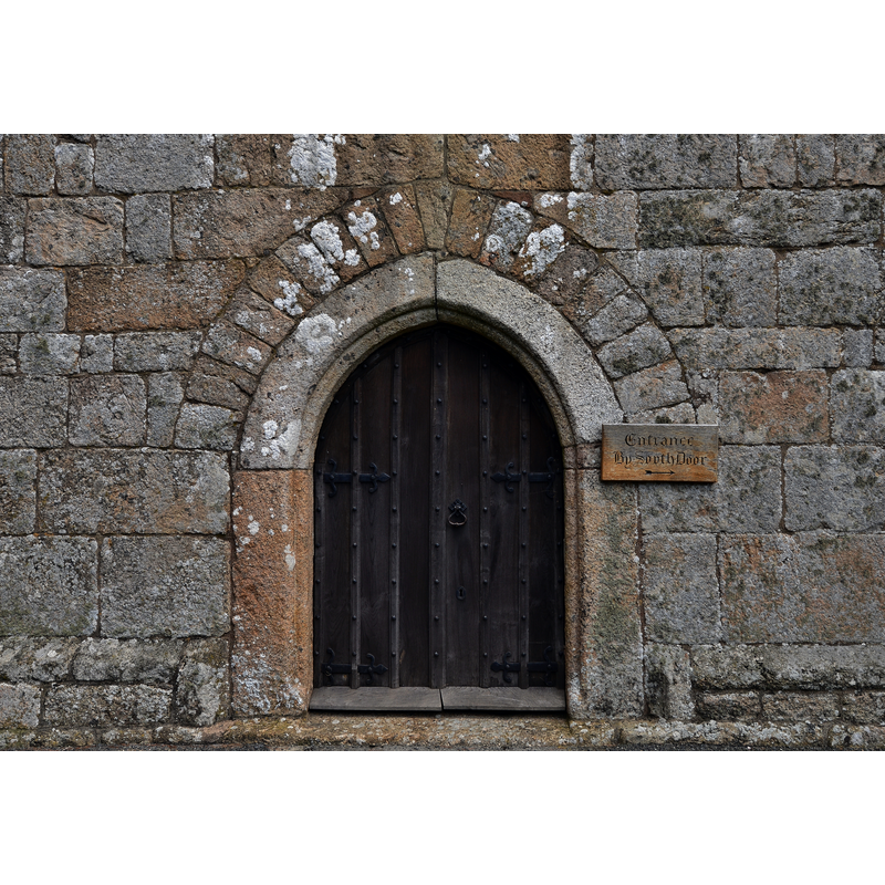 Source caption: "Drewsteignton, Holy Trinity Church: The west tower entrance"