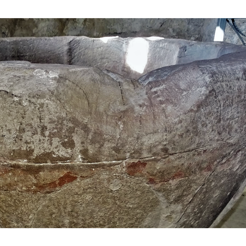 one of the damaged areas or the upper rim caused by a metal staple expanding and splitting the stone