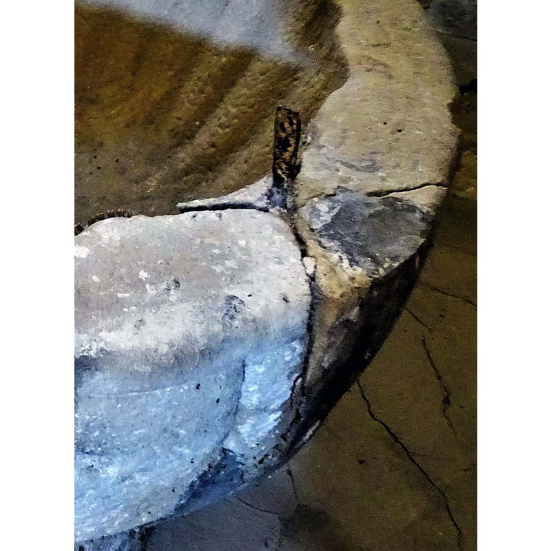 damage and repair related to one of the metal anchorings for the font cover