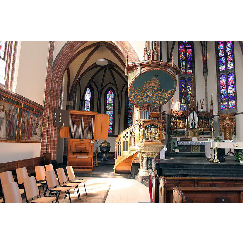 showing a font and cover in the apse, behind the organ