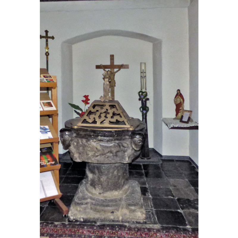 seen on this side of the font, passant to the left