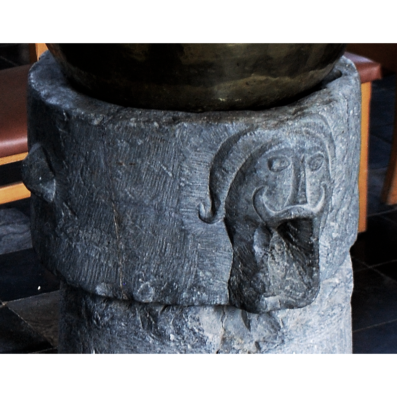 the lower part of the mouth may have been cut as a drain for the stone vessel [cf. FontNotes]