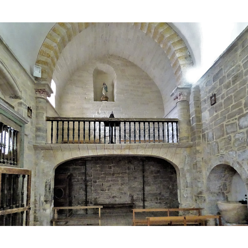 shpwing the font in its north wall alcove, opposite the south entranceway