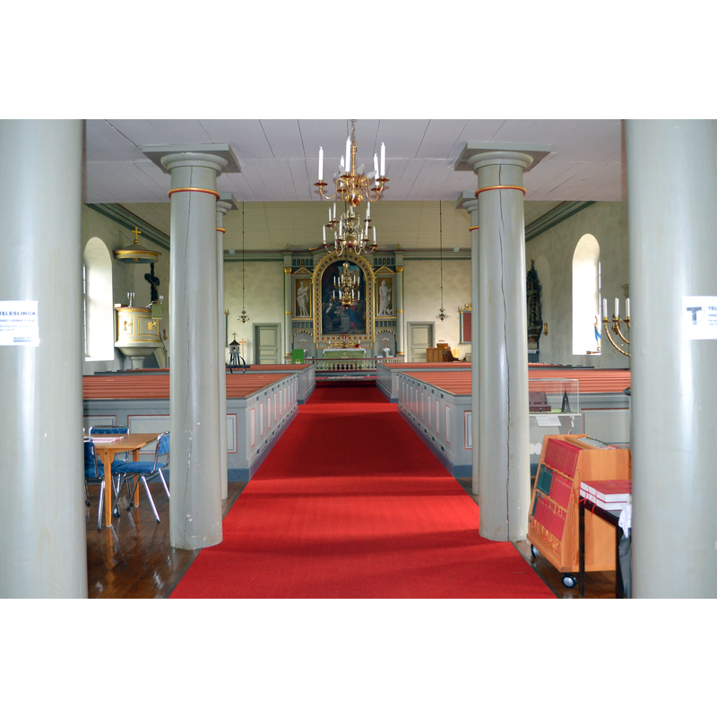 Source caption: "Pjätteryds kyrkas kykosal" -- inside the new church of 1841; notice in the foreground, right side of the image, behind the book kart, in a glass case, the maquette of the demolished medieval church
