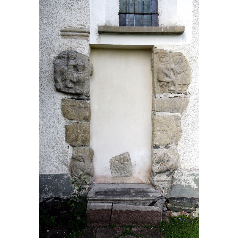 Source caption: "Torpa church in the landscape of Södermanland, Sweden. Portal with runic inscription (upper left stone)."