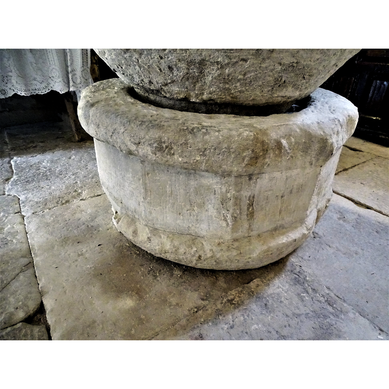 the base is octagonal but much eroded and damaged at the top rim, octagonal on the sides and round at the bottom; it looks suspiciously like the re-cycled basin of a small font or large stoup;