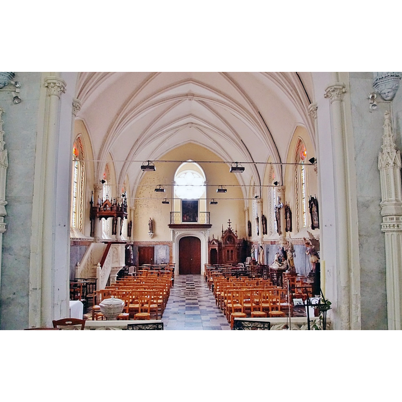 the modern font is partially visible in the foreground, left side; the church itself, of 1875 and much restored after WWI, had replaced earlier churches going back to the medieval period