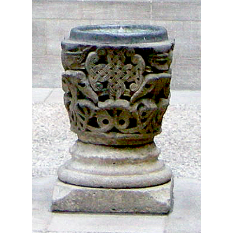 one of two baptismal fonts showing in the Saint-Guilhelm Cloister reconstructed in The Cloisters museum of the Metropolitan Museum in Fort Tryon Park, Manhattan, New York City