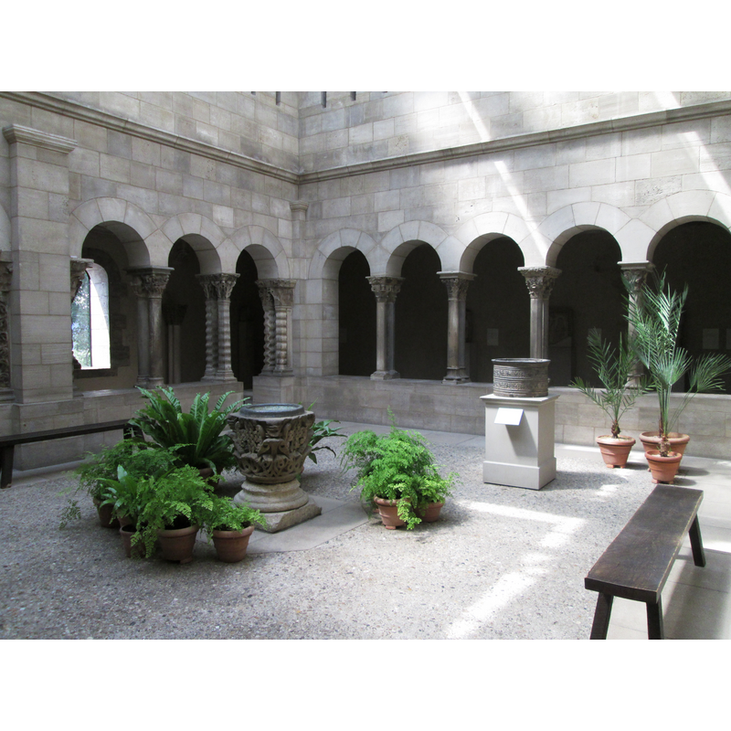The Saint-Guilhelm Cloister reconstructed in The Cloisters museum of the Metropolitan Museum in Fort Tryon Park, Manhattan, New York City -- showing the two baptismal fonts in it