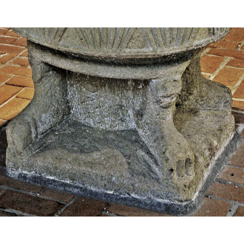 much damaged and eroded now; the one on the left still shows the hind quarters and the twisting tail but the end of the one on the right has been either damaged or re-carved