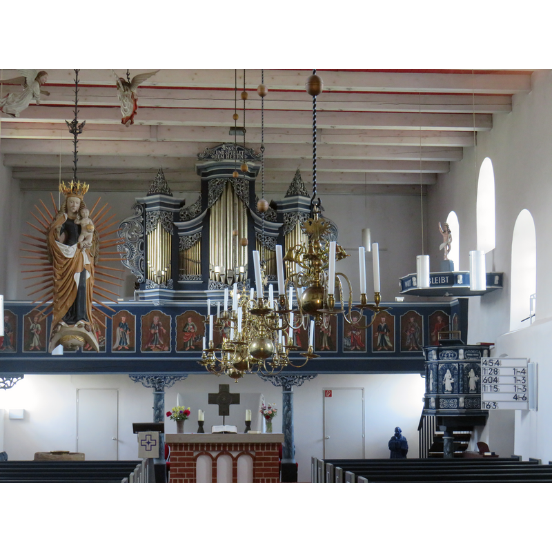 the font is beneath the Madonna statue