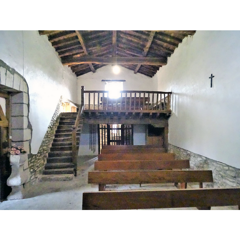 notice the large holy-water stoup by the entranceway