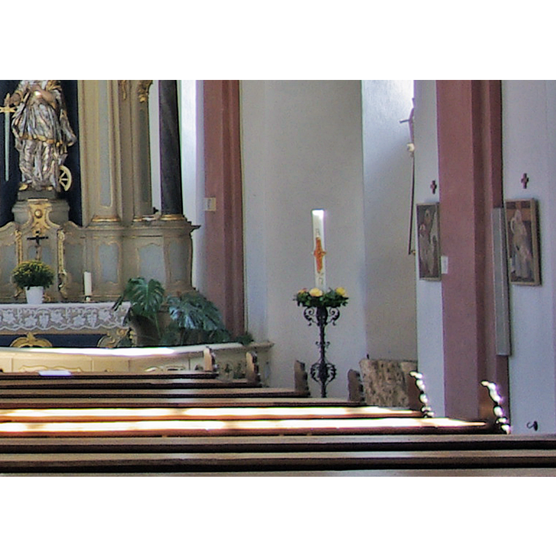 the font is partially visible here by the tall baptismal candle, on the right
