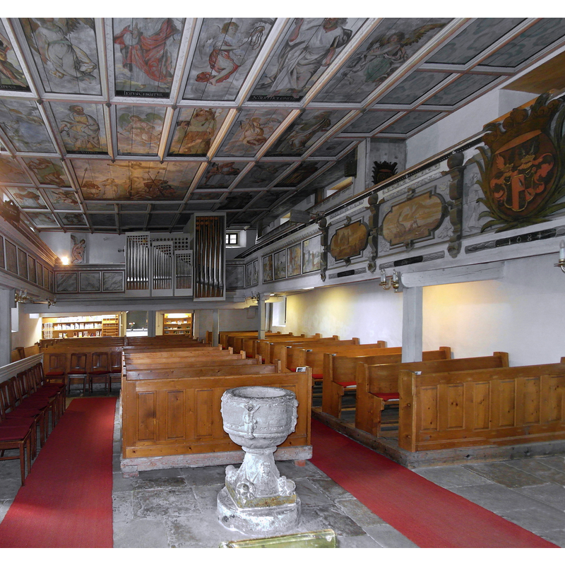 the baptismal font in the foreground