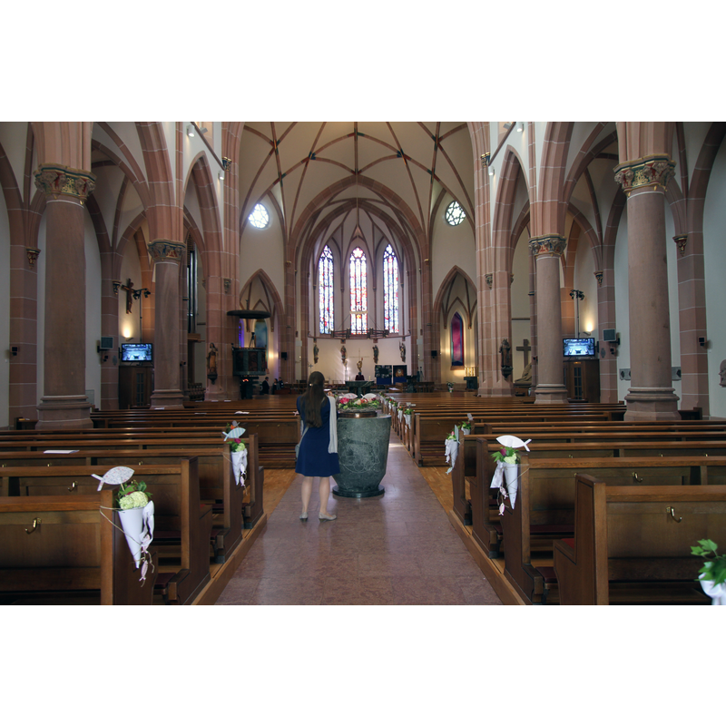 Source caption: "Kirche St. Peter und Paul in Bühl, Innenausstattung." -- the modern font inside the modern church