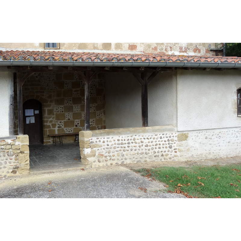 Source caption: "Porche de l'église de Bastanous."