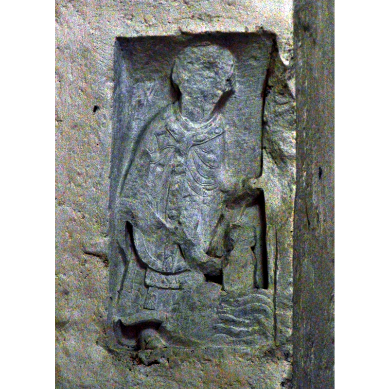 Source caption: "Décor sur un pilier de l'église Notre-Dame-de-la-Nativité, Bussière-Badil, Dordogne, France." -- baptismal scene?