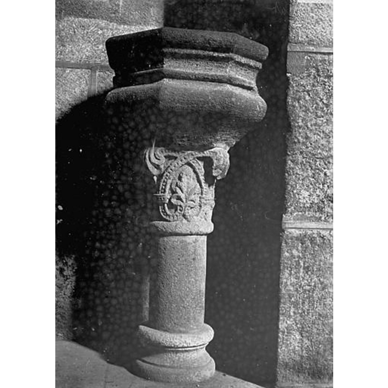 a holy-water stoup in the crypt