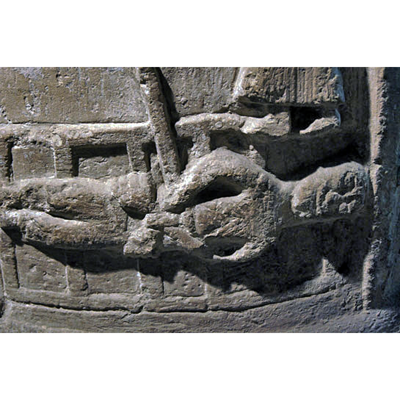 Source caption: "Close up of St Lawrence. In general, sculptors and artists right through the Norman and mediaeval periods were unwilling to depict any kind of pain on the faces of the martyrs. Perhaps it signified the knowledge that the victims would shortly be in Heaven."