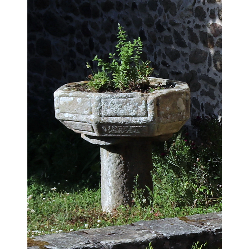 one of two such objects outside, by the west entranceway; this one on the north side