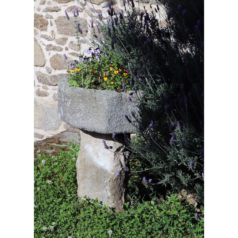 one of two such objects outside, by the west entranceway; this one on the south side