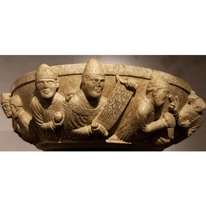 a number of them are shown here: at the extreme left is a mitred one accompanied by anothe figure with headgear --> in the centre is a bishop wearing a mitre and holding a round object decorated with a cross; his left hand is placed on the shoulder of the Pope --> in the centre is a large figure identified as Pope Alexander II in the scrool held up for view --> at the extreme right a priest(?) blesses goods presented by an accolyte