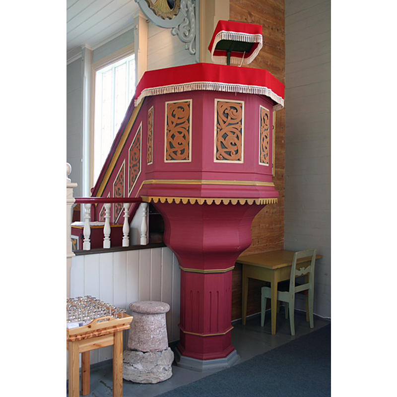 the base of the medieval font seen here beside the pulpit