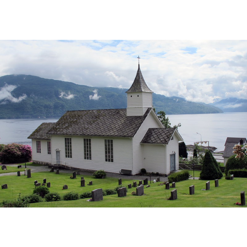 Source caption: "Holmedal kyrkje, juni 2017" -- the present church was built in 1882 1.7 km from the site of its medieval predecesor