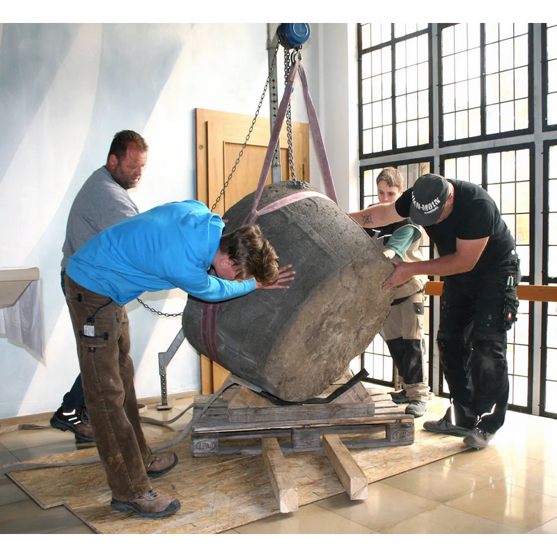 installation of the restored font in the new church