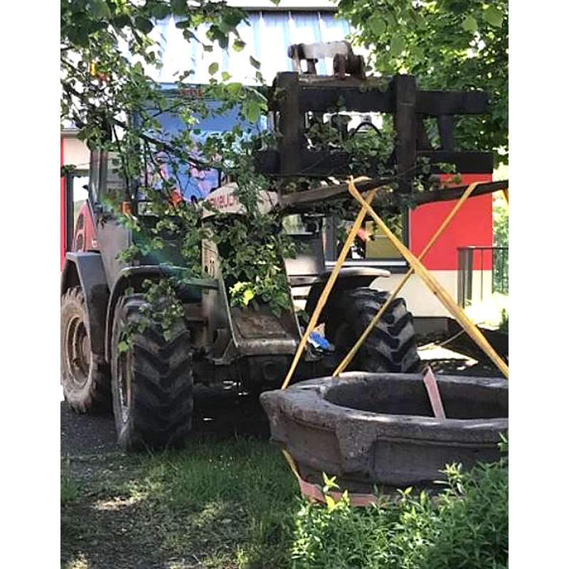 the rigged font is lifted by a front loader