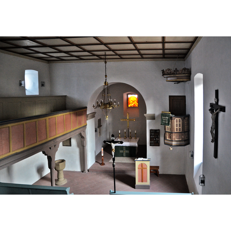 Source caption: " Evang.-Luth. Kirche in Volkershausen Innenraum" -- notice the baptismal font on the left [north] side, beneath the gallery